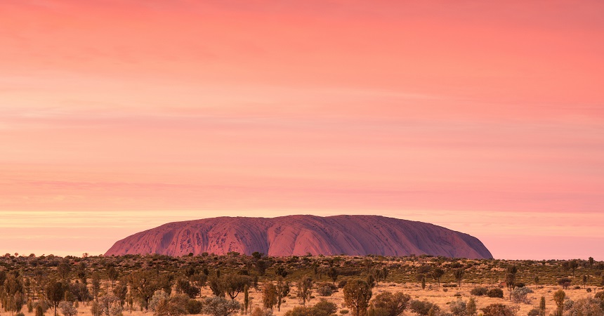 Changing colours of Uluru at sunrise